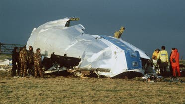 Families of the Lockerbie bombing victims said on August 14, 2003, a $2.7 billion compensation fund agreed by Libya was just the first step mercurial leader Muammar Gaddafi must take to prove he had quit the terrorism business. In this December 23, 1988 file photo, Scottish rescue workers and crash investigators search the area around the cockpit of Pan Am flight 103 in a farmer's field east of Lockerbie Scotland after a mid-air bombing killed all 259 passengers and crew, and 11 people on the ground. REUTERS/Greg Bos/files GB/