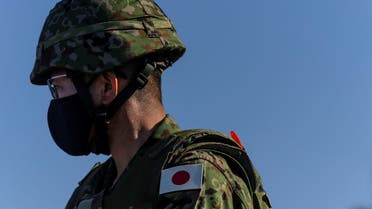 A member of the Japanese military watches Iron Fist 22 exercise training conducted by U.S. Marines and Japanese Ground Self-Defense Force (JGSDF) soldiers at U.S. Marine Base Camp Pendleton in Oceanside, California, U.S., February 9, 2022. REUTERS/Carlos Barria