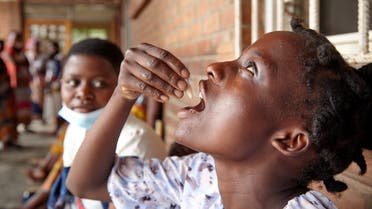 Eliza Tangwe, 18, takes a dose of oral cholera vaccine at a health centre in response to the latest cholera outbreak in Blantyre, Malawi, November 16, 2022. REUTERS/Eldson Chagara