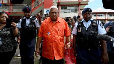 Fiji’s Prime Minister and Fiji First leader Frank Bainimarama leaves after voting at a polling station during the Fijian general election in Suva, Fiji, on December 14, 2022.  (Reuters)