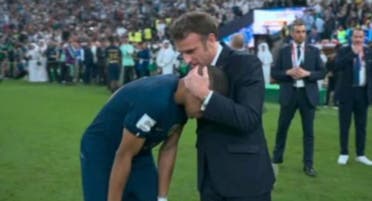 Macron and Mbappe on the field
