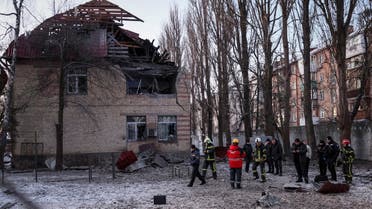 Rescuers and police officers examine parts of the drone at the site of a building destroyed by a Russian drone attack, as their attack on Ukraine continues, in Kyiv, Ukraine December 14, 2022. REUTERS/Gleb Garanich
