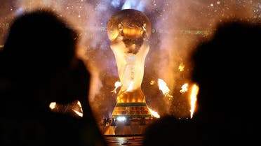 December 18, 2022 General view of a giant replica World Cup trophy and a pyrotechnic display inside the stadium before the match REUTERS/Kai Pfaffenbach. 