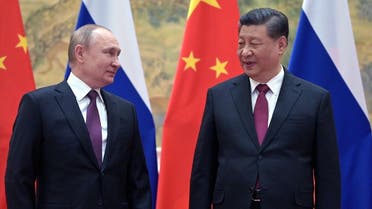 Russian President Vladimir Putin (L) and Chinese President Xi Jinping pose for a photograph during their meeting in Beijing, on February 4, 2022. (AFP)