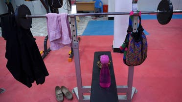 In this photo taken on September 29, 2020, a towel and handbag are seen hanging on a bench press at a women's gym in Kandahar. Once the epicentre of the Taliban’s iron-fisted Islamist government, Kandahar city in Afghanistan's restive south is slowly transforming into a vibrant urban centre dotted with bustling cafes, co-ed universities -- and even a women's gym. / AFP / ELISE BLANCHARD / TO GO WITH Afghanistan-conflict-Kandahar-culture,FOCUS by Elise BLANCHARD