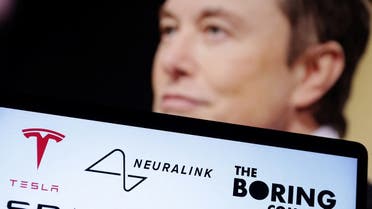Tesla, Neuralink, SpaceX, The Boring Company, and SolarCity logos are seen in front of Elon Musk photo in this illustration. (Reuters)