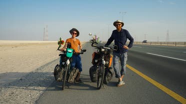 Julia and Tilmann Schöllnhammer pose for a picture by the side of the highway in the western United Arab Emirates, near the border with Saudi Arabia. (Marco Ferrari/Al Arabiya English)