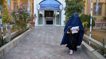 A female university Student walks in front of a university in Kandahar Province on December 21, 2022. (AFP)