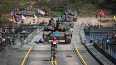 A South Korean soldier guides the tanks taking part in a joint river crossing operation drill between South Korean and U.S. troops, in Yeoju, South Korea, October 19, 2022. (File photo: Reuters)