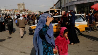 An Afghan woman and a girl walk in a street in Kabul, Afghanistan, November 9, 2022. (Reuters)
