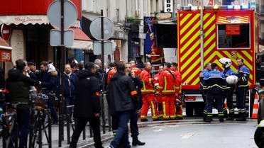 French police and firefighters secure a street after gunshots were fired killing two people and injuring several in a central district of Paris, France, December 23, 2022. (Reuters)