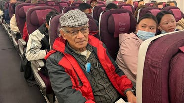 French serial killer Charles Sobhraj sits in an aircraft from Kathmandu to France, on December 23, 2022. (AFP)