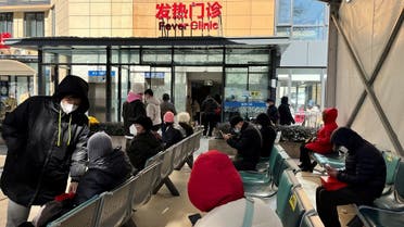 People wait outside a fever clinic at a hospital as coronavirus disease (COVID-19) outbreak continues, in Shanghai, China, on December 24, 2022. (Reuters)