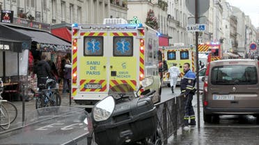 Ambulances are seen on a street after gunshots were fired in central Paris, France, December 23, 2022, in this still image obtained form a social media video. (Reuters)