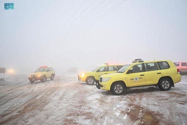 Police cars line up as snow falls in Tabuk, Saudi Arabia, on December 27. (SPA)