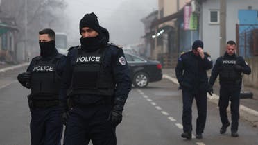 Kosovo police officers patrol near a roadblock, near the northern part of the ethnically-divided town of Mitrovica, Kosovo, on December 27, 2022. (Reuters)