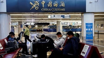 Travel curbs rack up as COVID-19 hit China readies to reopen