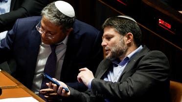 Israeli right-wing Knesset members Itamar ben Gvir and Bezalel Smotrich attend a session at the plenum at the Knesset, Israel’s parliament in Jerusalem on December 28, 2022. (Reuters)