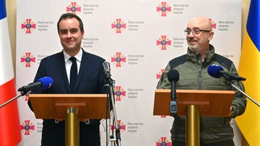 French Armies Minister Sebastien Lecornu and Ukrainian Defense Minister Oleksiy Reznikov deliver a press conference in Kyiv during French Armies Minister’s first visit to Ukraine on December 28, 2022. (AFP)