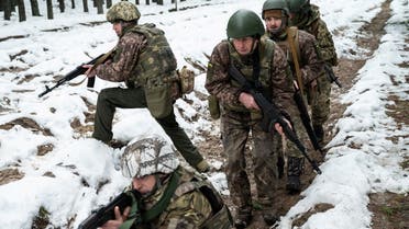 Ukrainian service members attend a military exercise session near the border with Belarus, amid Russia’s attack on Ukraine, in Zhytomyr region, Ukraine, on December 27, 2022. (Reuters)