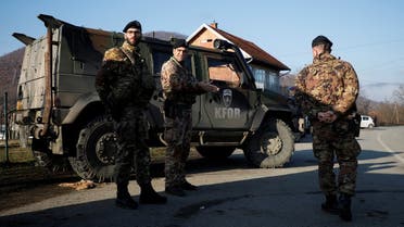Members of the Italian Armed Forces, part of the NATO peacekeeping mission in Kosovo, stand near a roadblock in Rudare, near the northern part of the ethnically-divided town of Mitrovica, Kosovo December 29, 2022. (Reuters)