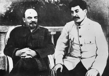 Soviet founder Vladimir Lenin, left, and Soviet leader Josef Stalin sit in a park at Gorki residence in 1922 just outside Moscow, Russia. (AP)