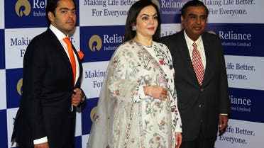 Mukesh Ambani, Chairman and Managing Director of Reliance Industries, poses with his wife Nita Ambani and son Anant Ambani before addressing the company's annual general meeting in Mumbai, India,on July 5, 2018. (Reuters)