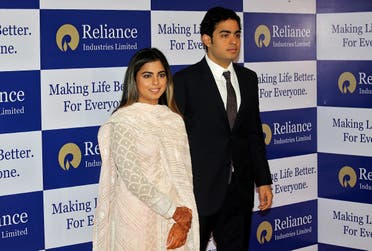 Isha Ambani and Akash Ambani, children of Mukesh Ambani, Chairman and Managing Director of Reliance Industries, pose for a photograph as they arrive to attend the company’s annual general meeting in Mumbai, India, on July 5, 2018. (Reuters)