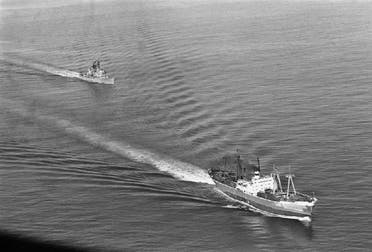 US Navy guided missile ship Dahlgren trails the Soviet Leninsky Komsomol, Nov. 10, 1962, as the Russian vessel headed from Casilda, Cuba, through the windward passage between Haiti and Cuba. (AP)