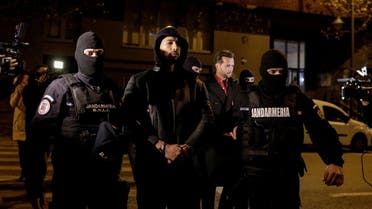Andrew Tate and Tristan Tate are escorted by police officers outside the headquarters of the Directorate for Investigating Organized Crime and Terrorism in Bucharest (DIICOT) after being detained for 24 hours, in Bucharest, Romania, on December 29, 2022. (Reuters)