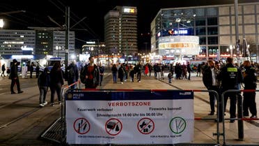 People walk in the No Fireworks Zone at Alexanderplatz on New Year’s Eve in Berlin, Germany, on December 31, 2022. (Reuters)