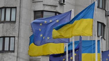 Flags of Ukraine and European Union wave at European Square in Kyiv on June 24, 2022. (AFP)