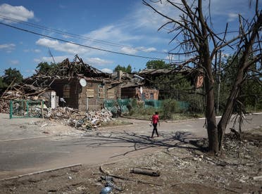 A local resident walks near buildings destroyed by Russian military strike, amid Russia’s invasion on Ukraine, in the town of Druzhkivka, in Donetsk region, Ukraine, on June 6, 2022. (Reuters)