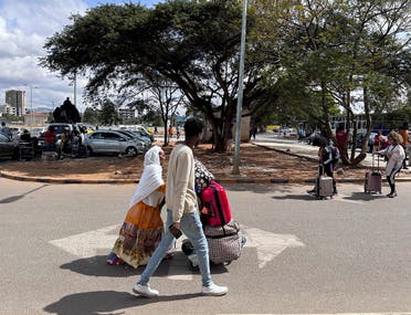 Passengers arrive before travelling on board the Ethiopian Airlines plane that resumes flights to Mekelle, the capital of Tigray, at the Bole International Airport in Addis Ababa, Ethiopia December 28, 2022. (Reuters)