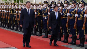 Chinese President Xi Jinping and Philippine President Ferdinand Marcos Jr review the honour guard during a welcome ceremony at the Great Hall of the People in Beijing, China January 4, 2023. (Reuters)