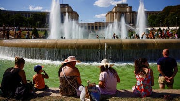 People cool off in the Trocadero fountains near the Eiffel Tower in Paris as a heatwave hits France, on August 3, 2022. (Reuters)