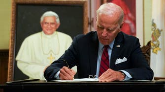 Biden signs condolences for former Pope Benedict in Washington 