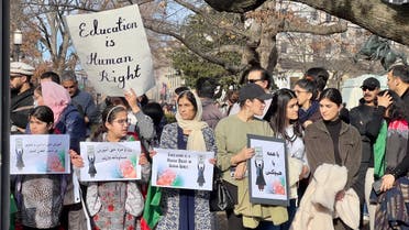 People demonstrate in front of the White House in Washington, DC, on January 1, 2023 against the Afghan Taliban regime’s ban of higher education for women. (AFP)