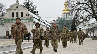 Ukrainian servicemen arrive to attend the Christmas service in the Assumption Cathedral of the Kyiv Pechersk Lavra on January 7, 2023, amid the Russian Invasion of Ukraine. (AFP)