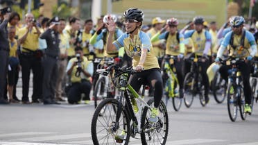Thailand’s Princess Bajrakitiyabha waves to crowd as she cycles in the “Bike for Dad” event in Bangkok, Thailand. (File photo: Reuters)