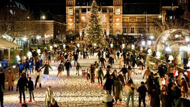 People skate on an ice rink that has been temporarily set up for the Christmas period in front of the Rijksmuseum in Amsterdam, Netherlands, on December 16, 2022. (Reuters)
