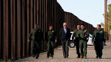 US President Joe Biden speaks with border patrol officers as he walks along the border fence during his visit to the U.S.-Mexico border to assess border enforcement operations, in El Paso, Texas, US, January 8, 2023. (Reuters)
