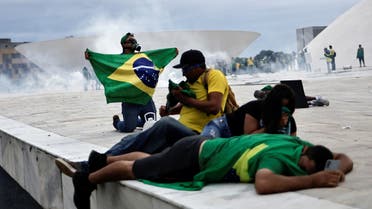 Supporters of Brazil's former President Jair Bolsonaro react during a demonstration against President Luiz Inacio Lula da Silva, outside Planalto Palace in Brasilia, Brazil, January 8, 2023. (Reuters)