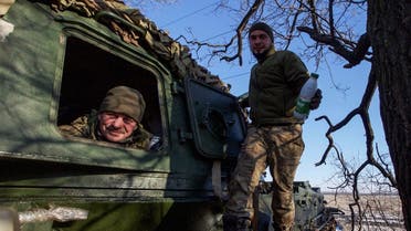 Ukrainian servicemen look on from a 2S3 Akatsiya self-propelled howitzer at their position in a frontline, amid Russia’s attack on Ukraine, in Donetsk region, Ukraine, on January 8, 2023. (Reuters)