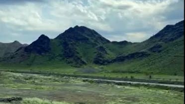 A video shot by a Saudi weather enthusiast showed the mountains covered in green and grass growing in vast spaces around them. (Screengrab)