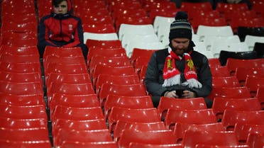 Liverpool fans sit inside the stadium before a match on January 7, 2023,  Anfield, Liverpool, Britain. (Reuters)