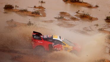 Bahrain Raid Xtreme's Sebastien Loeb and co-driver Fabian Lurquin in action during stage 9. (Reuters)