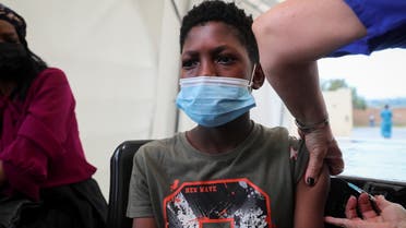 A healthcare worker administers the Pfizer coronavirus disease (COVID-19) vaccine to Simphiwe, 13, amidst the spread of the SARS-CoV-2 variant Omicron in Johannesburg, South Africa, December 04, 2021. (Reuters)