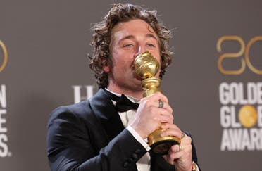 Jeremy Allen White poses with his award for Best Actor in a Musical or Comedy TV series for The Bear at the 80th Annual Golden Globe Awards in Beverly Hills, California, U.S., January 10, 2023. (Reuters)