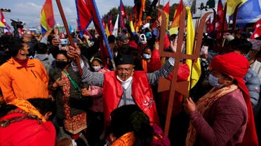 Supporters of monarchy gather as they celebrate the birth anniversary of the late king Prithvi Narayan Shah who formed present Nepal centuries ago, amid the ban on large public gatherings involving more than 25 people due to the spread of coronavirus disease (COVID-19) outbreak in Kathmandu, Nepal January 11, 2022. (Reuters)